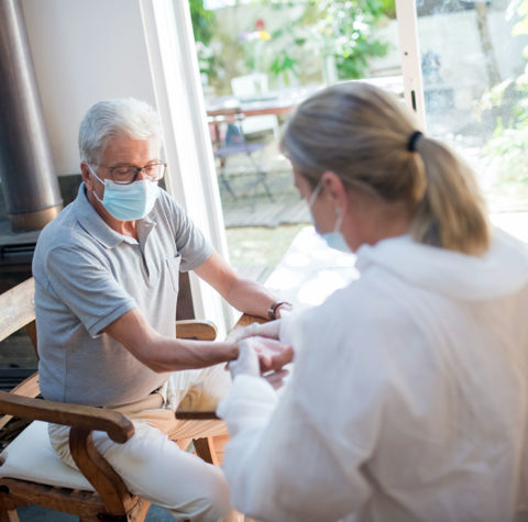 man-receiving-medical-checkup-at-home-960x950