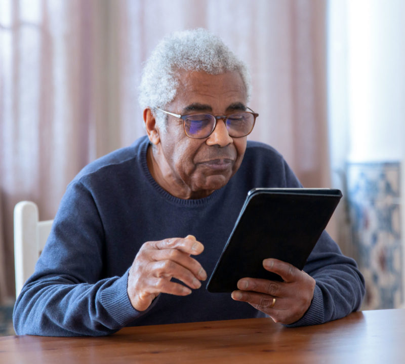 senior man and tablet